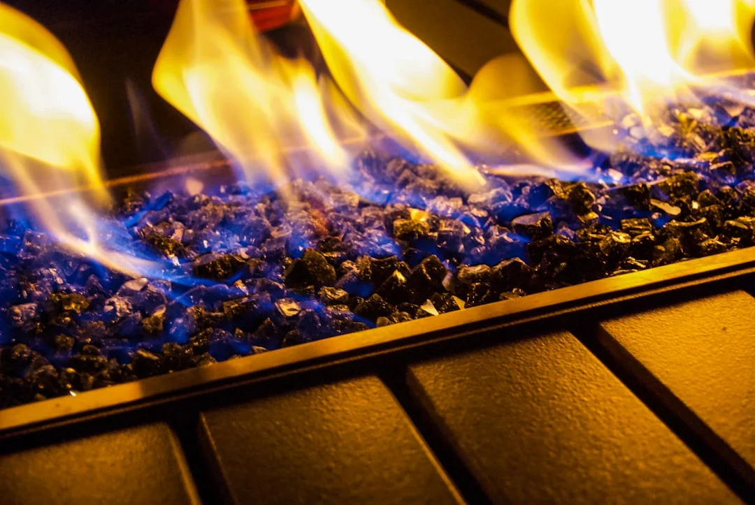 A properly sealed and capped gas pipe inside a clean fireplace firebox, indicating a professional job.