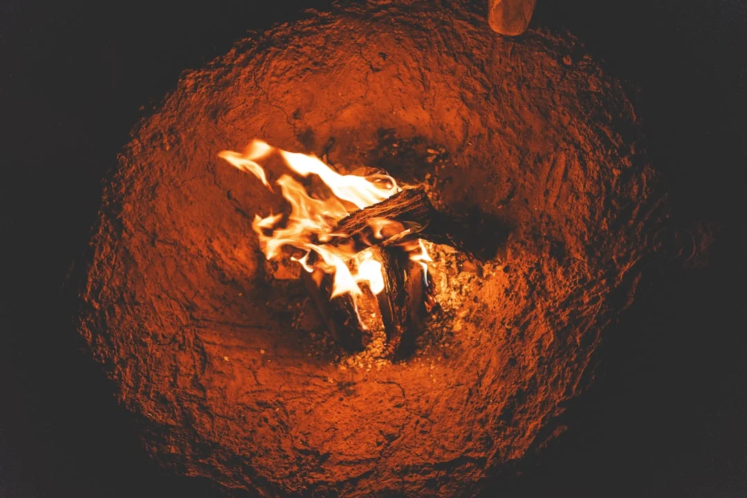 A properly set up gas fireplace with the correct silica sand and ceramic logs, demonstrating the safe use of approved materials.