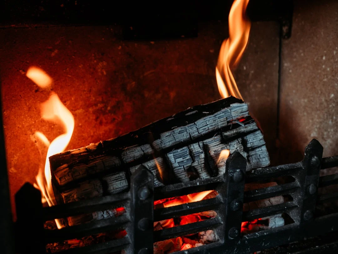 A close-up view of a fireplace mantel with a visible gap between it and the wall, illustrating the problem of separation.