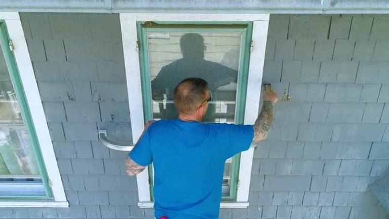A person is painting home