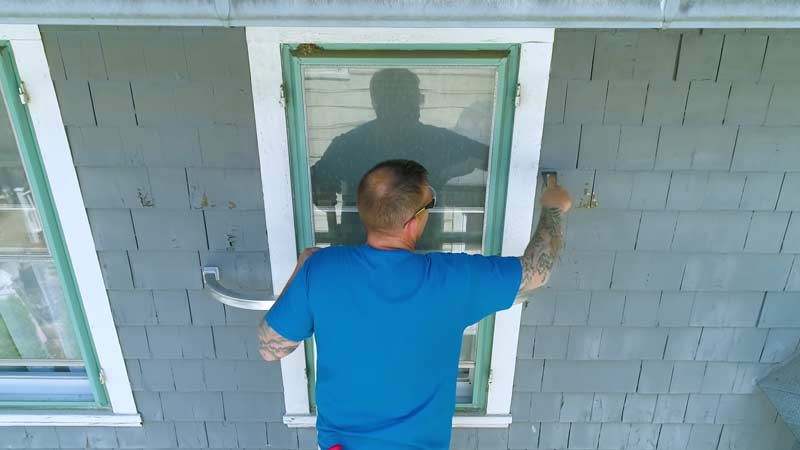 A person is painting home