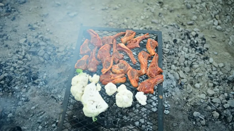 Cooking Chickens over Net Logs