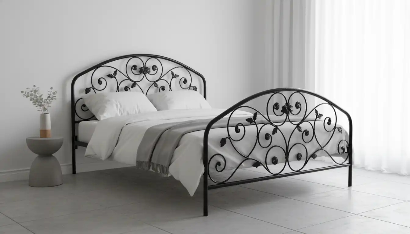 An ornate black wrought iron bed frame with intricate scrollwork on the headboard and footboard, placed in a minimalist bedroom.