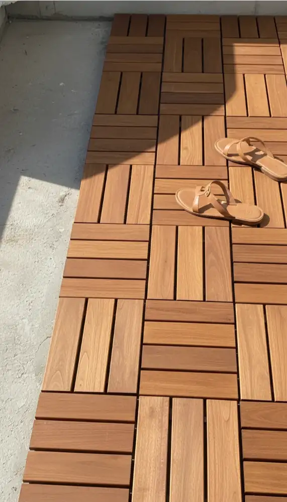 Interlocking wood deck tiles covering a balcony floor