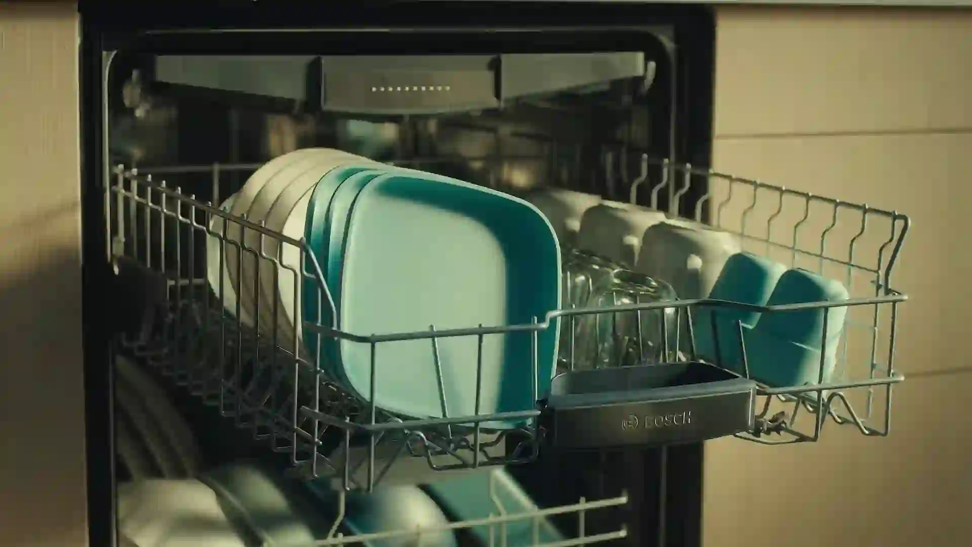 A sleek, stainless steel two-drawer dishwasher installed flush with kitchen cabinetry.