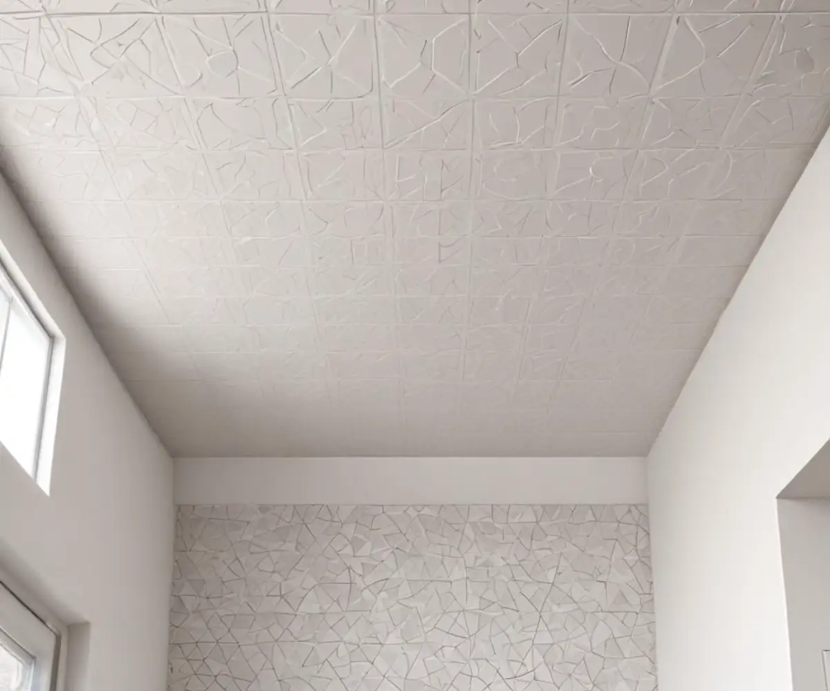 White patterned peel and stick tiles covering a smooth, flat residential ceiling.