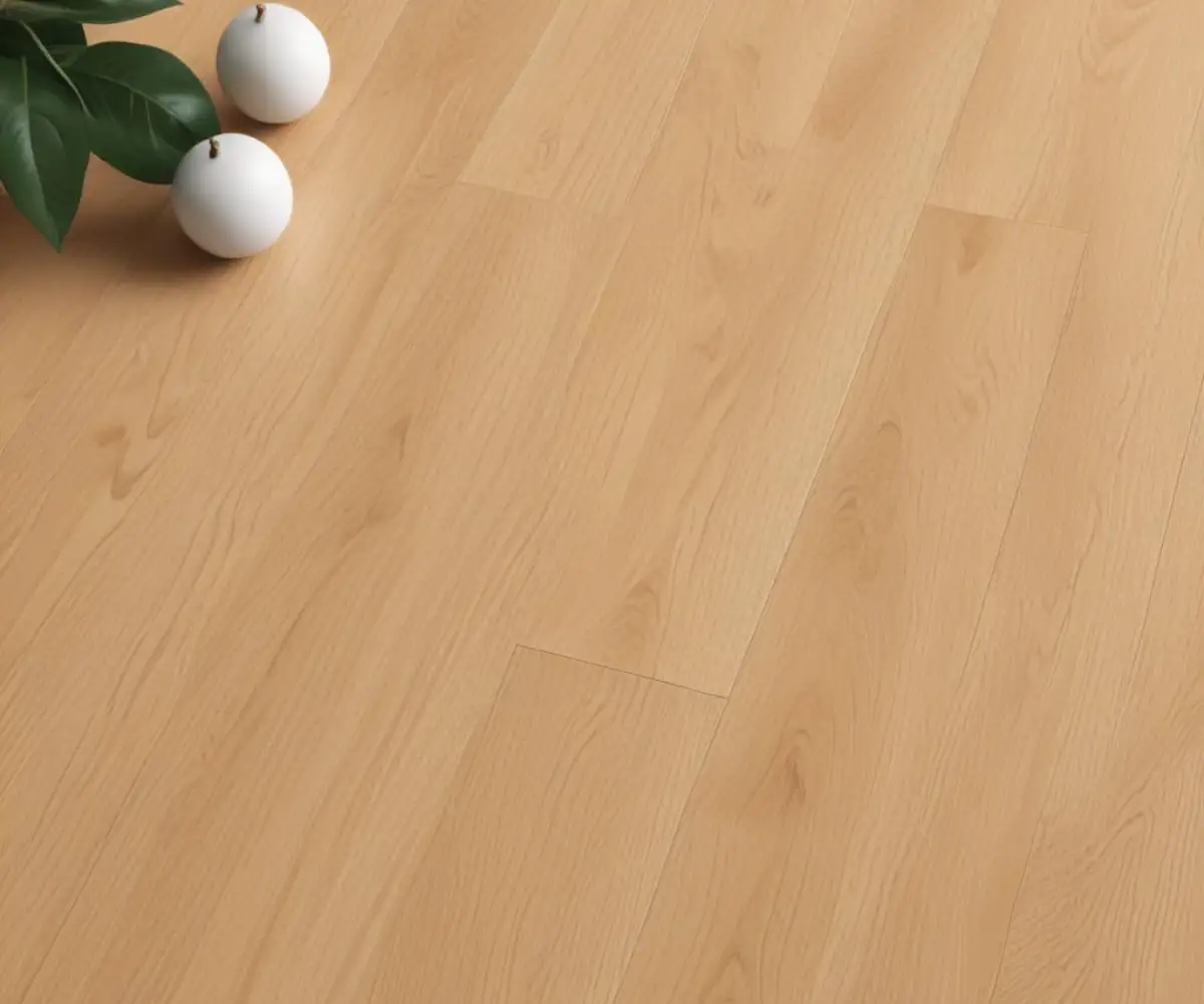A detailed close-up of light oak colored luxury vinyl plank flooring, showcasing the realistic wood grain texture and beveled edges.