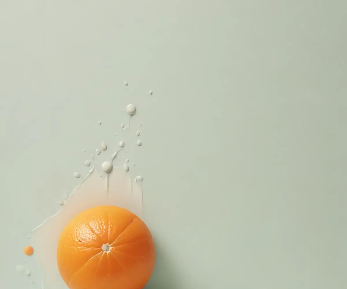 Close-up of an orange, dimpled waterproofing membrane being installed on a light-colored wall.