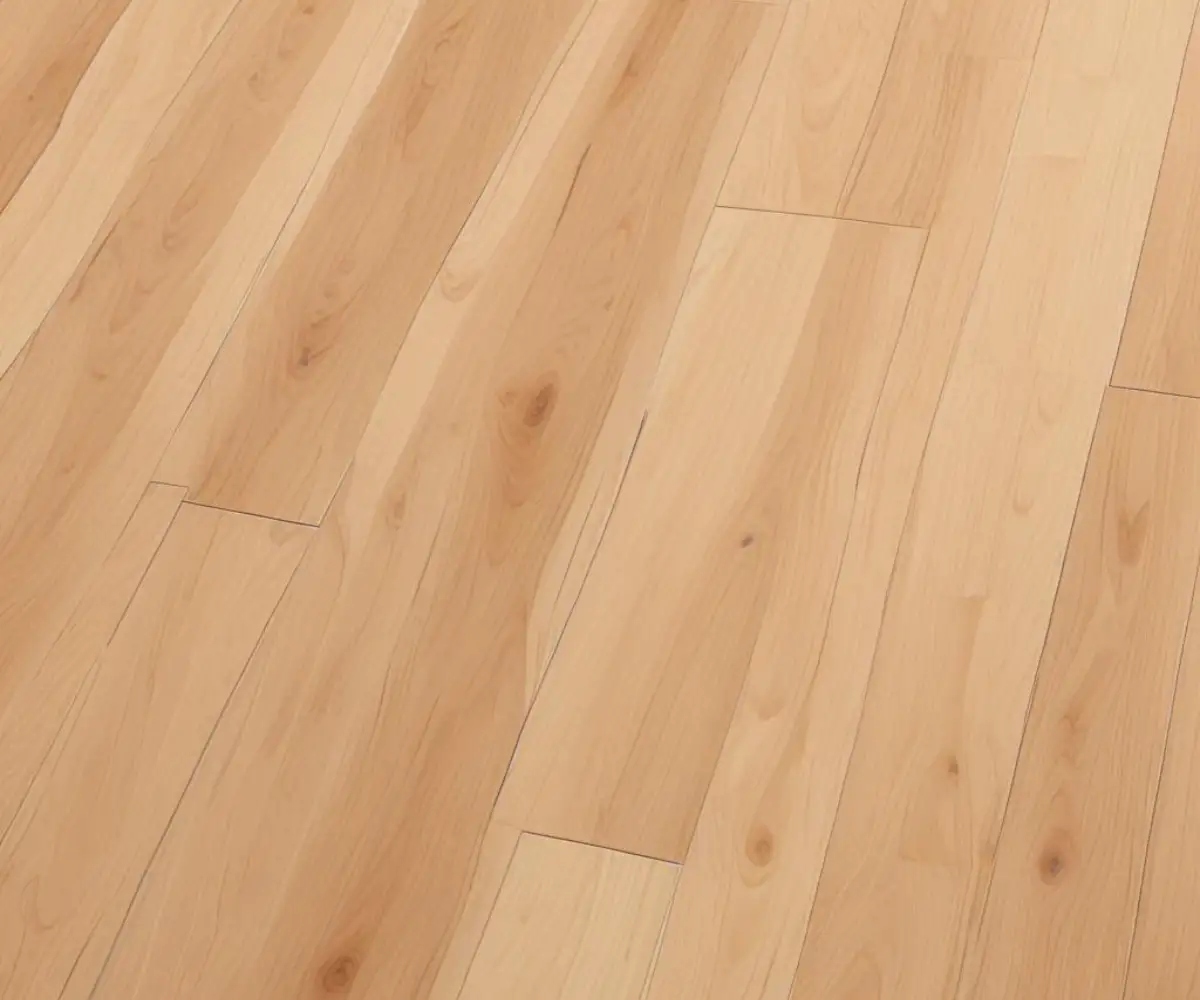 A close-up view of light wood-grain laminate flooring planks neatly installed at an angle.
