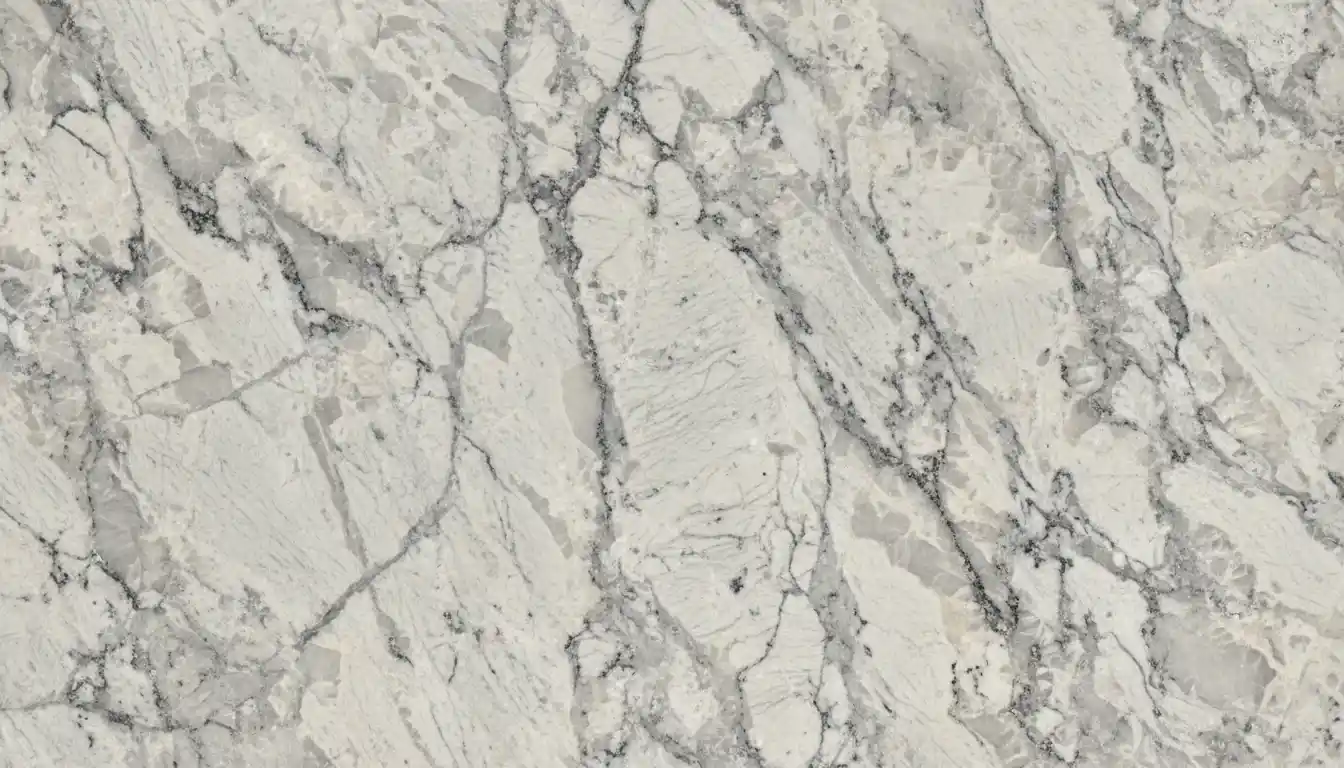 A close-up view of a polished Stonemark granite countertop slab showing its natural grey and white veining and crystalline texture.