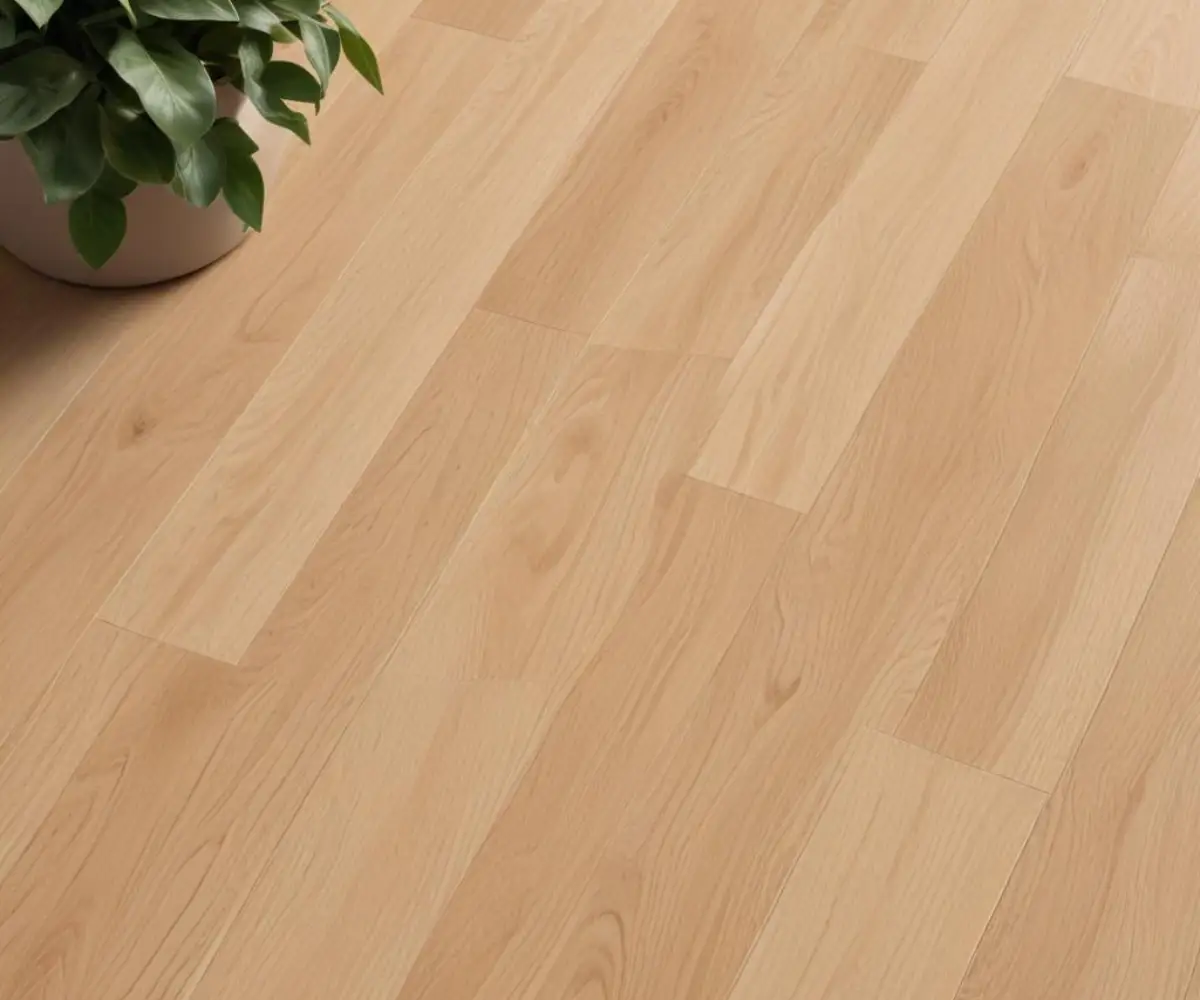 A detailed close-up of light oak Vesdura vinyl plank flooring showcasing its wood grain texture.