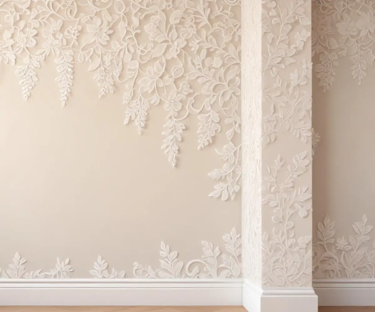 A smooth wall painted in a soft off-white color, accented with intricate, delicate white lace trim.